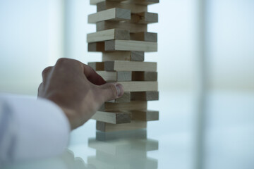 Wood Jenga on glass table