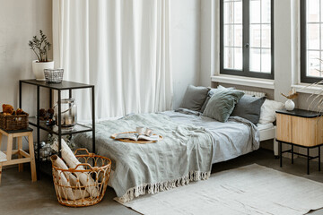 Modern Scandinavian-style bedroom interior design in blue and white colors.