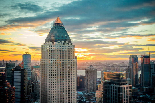 Aerial View of Buildings, Skyscrapers and Towers in Manhattan at Sunset, Hudson River and Jersey City in Background. New York City, USA