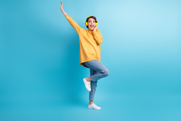 Full length body size side profile photo of girl listening song enjoying earphones opened mouth isolated on bright blue color background