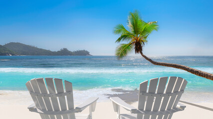 Sunny beach with beach chairs on white sand, tropical sea and coco palms. Summer vacation and tropical beach concept.	