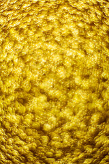 Gold dust background blurred, small gold dust reflects light