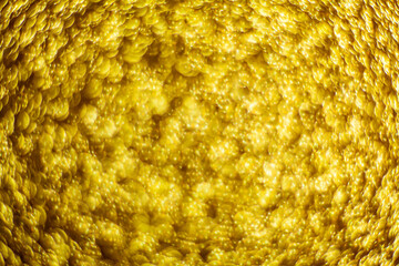 Gold dust background blurred, small gold dust reflects light