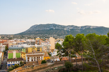 Fototapeta na wymiar Denia cityscape. Aerial view from the historic moorish castle in the old town that holds the Palau del Governador. Costa Blanca, Alicante province, Valencian community, Spain.