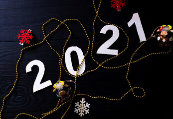 Figures 2021 on a black background.