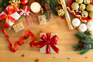 Christmas gifts on wooden table. Overhead view of christmas ornaments