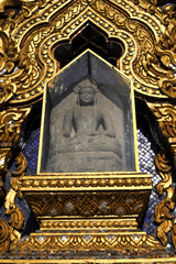 The Buddha image at Tympanum of the Pagoda of Wat Thammamongkol temple in Bangkok Thailand