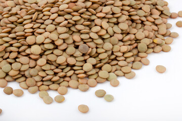 dry green lentils on a white background