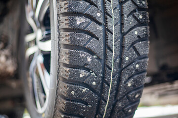 winter studded tires on car, selective focus