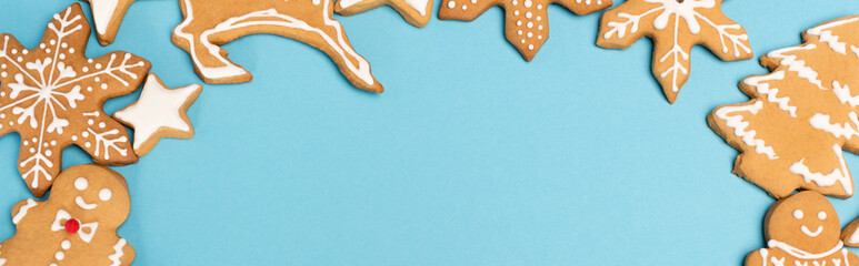 top view of winter gingerbread cookies on blue background, 