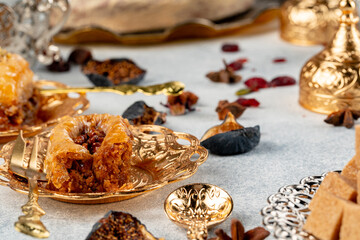 Piece of Turkish baklava in golden arabic plate