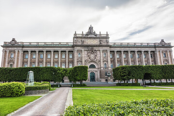Obraz premium Neoclassical style of Sweden Parliament Building (Sveriges Riksdag) at Helgeandsholmen Island in the Gamla stan (Old Town) district of central Stockholm. Sweden.