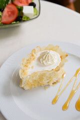 Almond cream cake on a plate