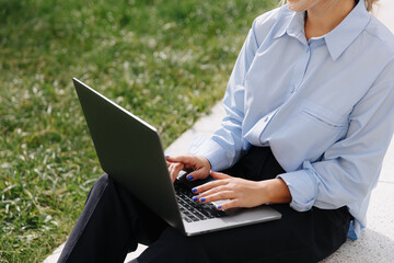 Female hipster working on portable computer