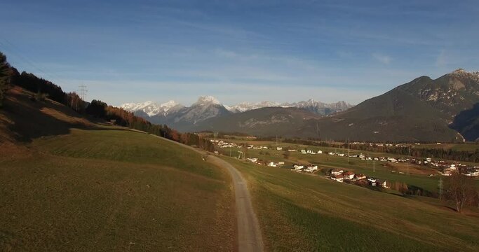 Innsbruck aerial view. Aerial Shots in the Alps. Spectacular panorama of city Innsbruck and Nordkette Mountain Range in Austria. 