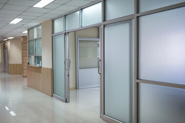 Hospital corridor and open door to ward