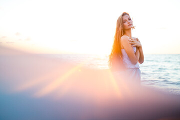 mermaid myth in sunset on beach shore with fish star shells pearls earrings jewelry