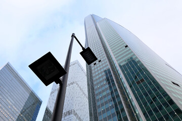 LED street lamp post on skyscrapers background. Modern led lights in city, saving of electrical energy