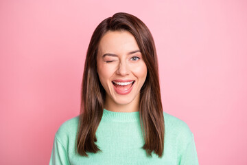 Fototapeta premium Photo portrait of beautiful young brunette smiling happily winking blinking isolated on pastel pink color background