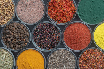 Obraz na płótnie Canvas Assortment colorful spices, seeds and herbs for cooking food, top view