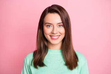 Photo portrait of cheerful happy brunette girl smiling isolated on pastel pink color background