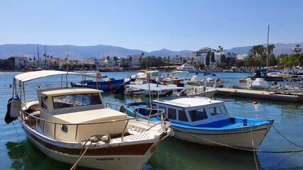 Fototapeta na wymiar Boats in the marina in downtown Kos, Greece