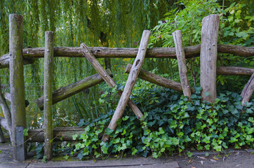 old wooden fence with green grass