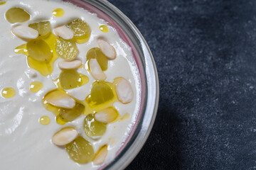 Traditional Spanish dish, cold soup ajo blanco or ajoblanco from garlic, almonds, white wine vinegar, olive oil and grapes