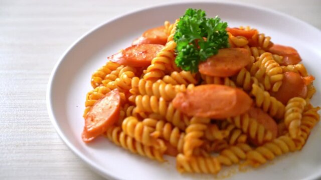 spiral or spirali pasta with tomato sauce and sausage - Italian food style