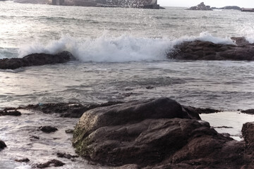 waves crashing on rocks