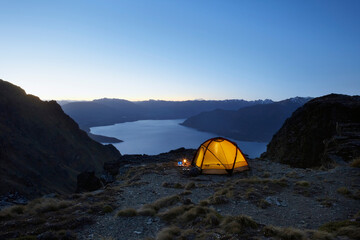 Tent By Lakeshore At Dusk