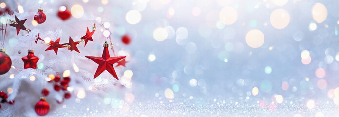 Holiday Background With Christmas Tree And Red Stars. Shining Bokeh Effects