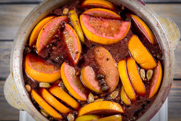Above view of mulled wine preparing in kettle