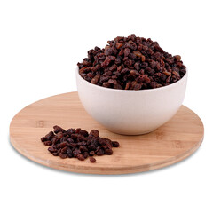 Brown raisins in white ceramic bowl on wood board isolated on white background, copy space.