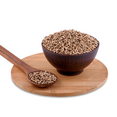 White pepper peas in brown bowl and spoon on wood board isolated on white background, copy space.