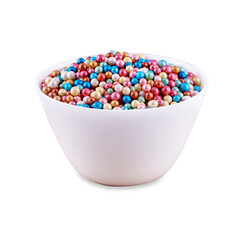 Colorful sugar dragee in white bowl isolated on white background, copy space.