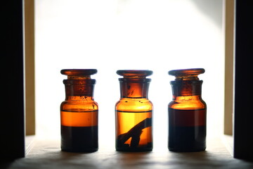 Still life of brown bottles with a ground lid. Chemistry / Alchemy lab. 