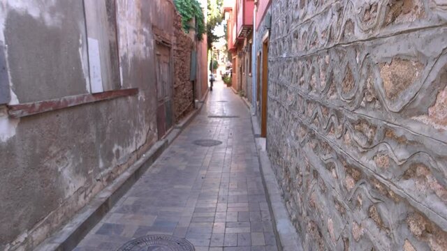 Old cobbled street of an ancient cty at Turkey. Narrow street and historical architecture of old town Kaleici at Antalya, Turkey.