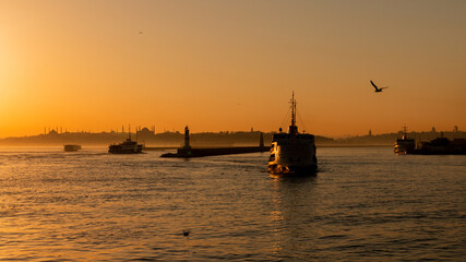 beautiful silhouette of istanbul city  and ferrys at sunset