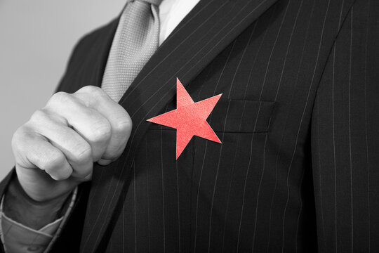 Businessman With Red Star On Suit