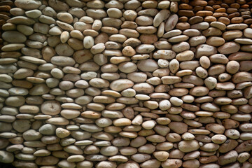 The pedestrian walkway is made from beautiful natural stone. Yellow brown Texture background for graphic design.