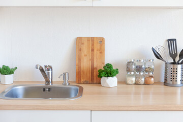 Scandinavian classic minimalistic kitchen with white and wooden details. Modern white kitchen clean contemporary style interior design.