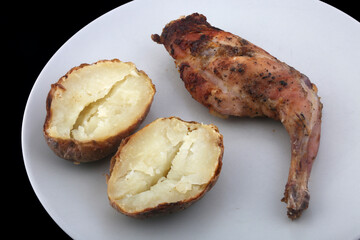 roast cooked rabbit with potatoes
