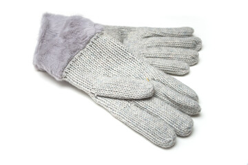 Fototapeta na wymiar Closeup of grey woolen gloves on white background