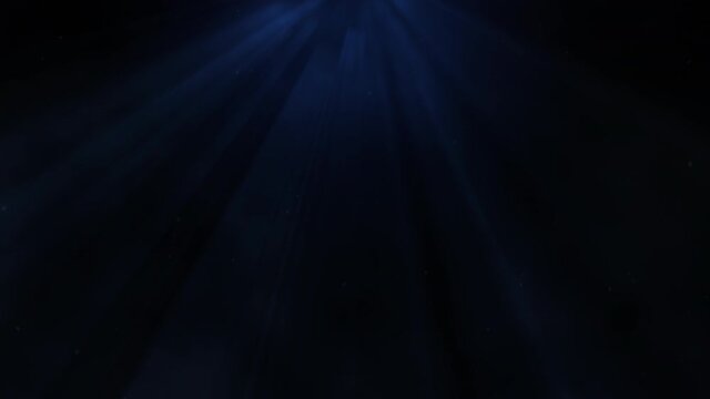 Dramatic blue light beam with flying flicker particles and smoke effect abstract background.
