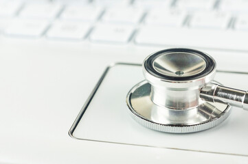 stethoscope and keyboard, a computer aid concept