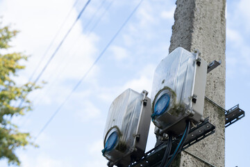 electric meters on a pole, the concept of rising utility rates