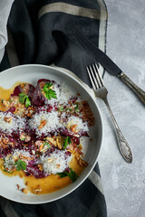 Jerky beef with caramelized beets. A dish for a restaurant. Dark tones