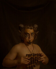 Horned faun with panflute