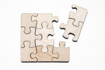 Connect empty wooden puzzles on a white background. Top view. 3D illustration